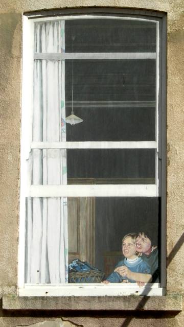 Clever mural in a blank-faced building.